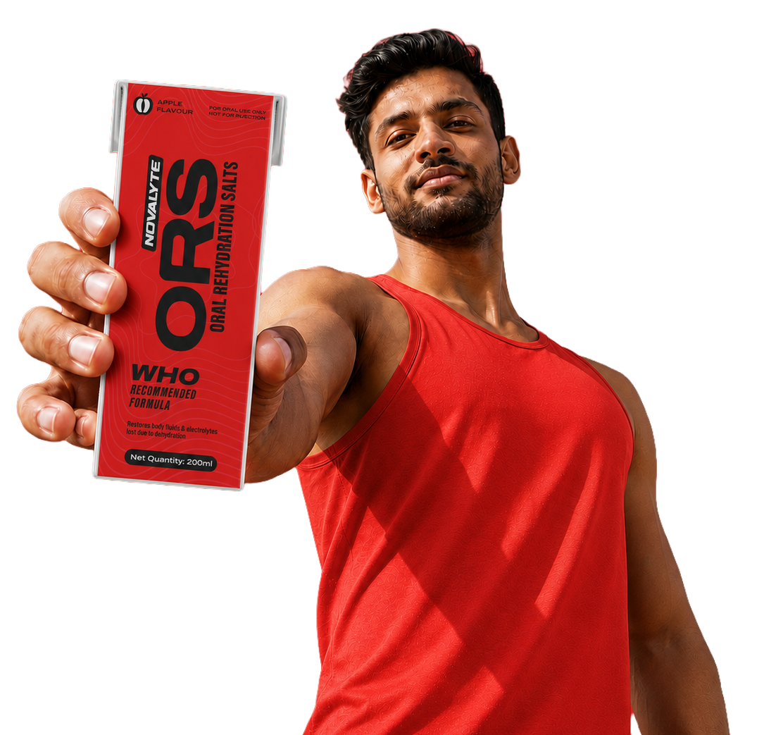 Athlete holding Novalyte ORS apple flavour tetra pack